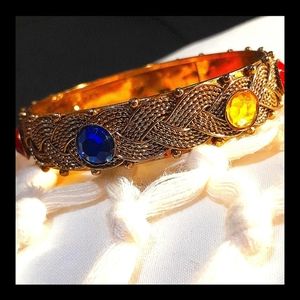 Stunning braided bracelet in rustic gold and colorful gems.